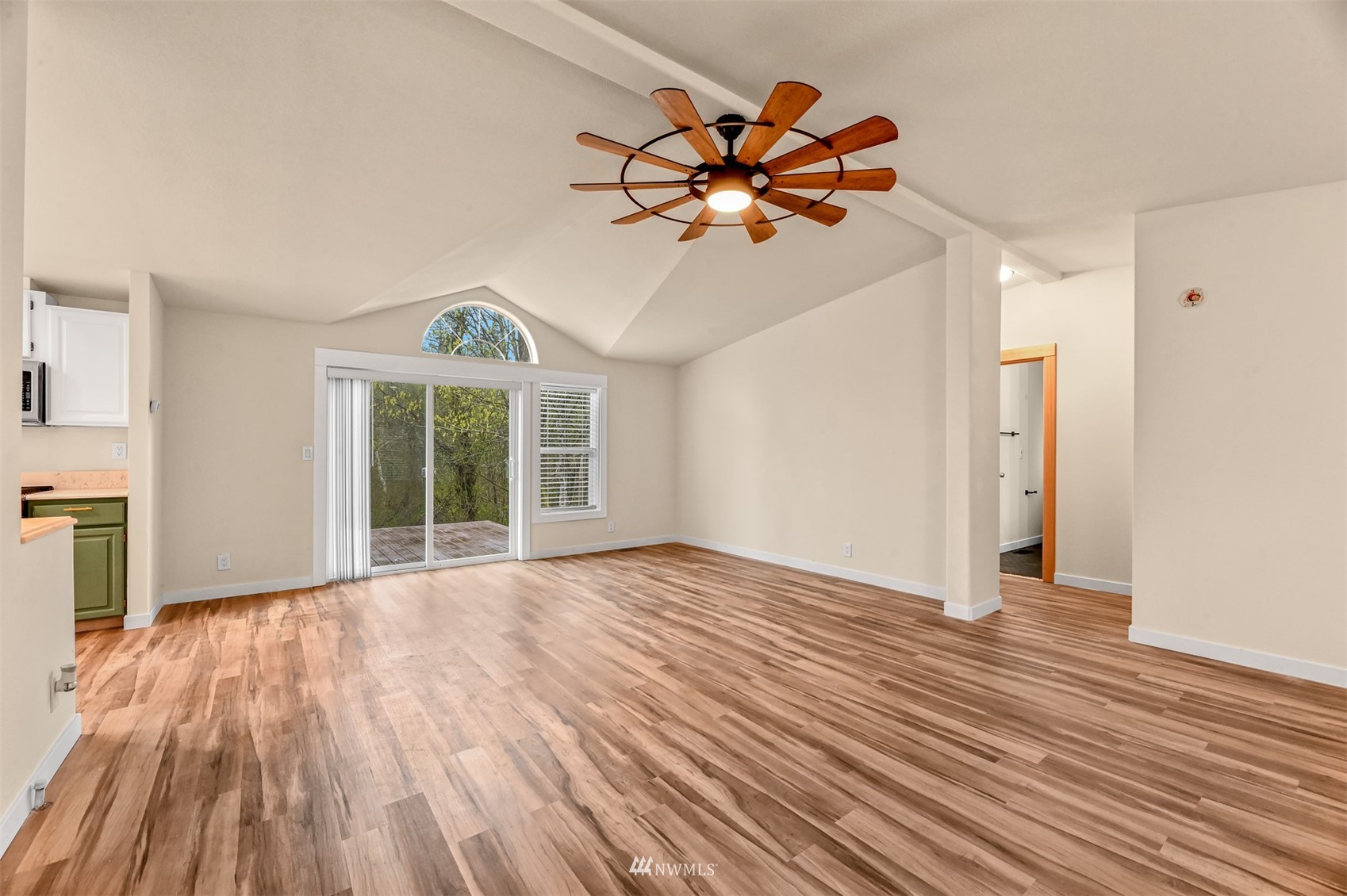 4423 Masterson Road Birch Bay, WA 98230 - Photo 8 of 20 a view of a livingroom with wooden floor and a ceiling fan