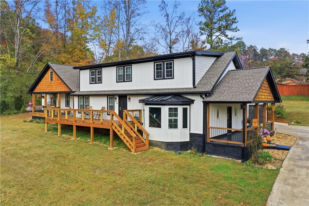 a front view of a house with a yard table and chairs