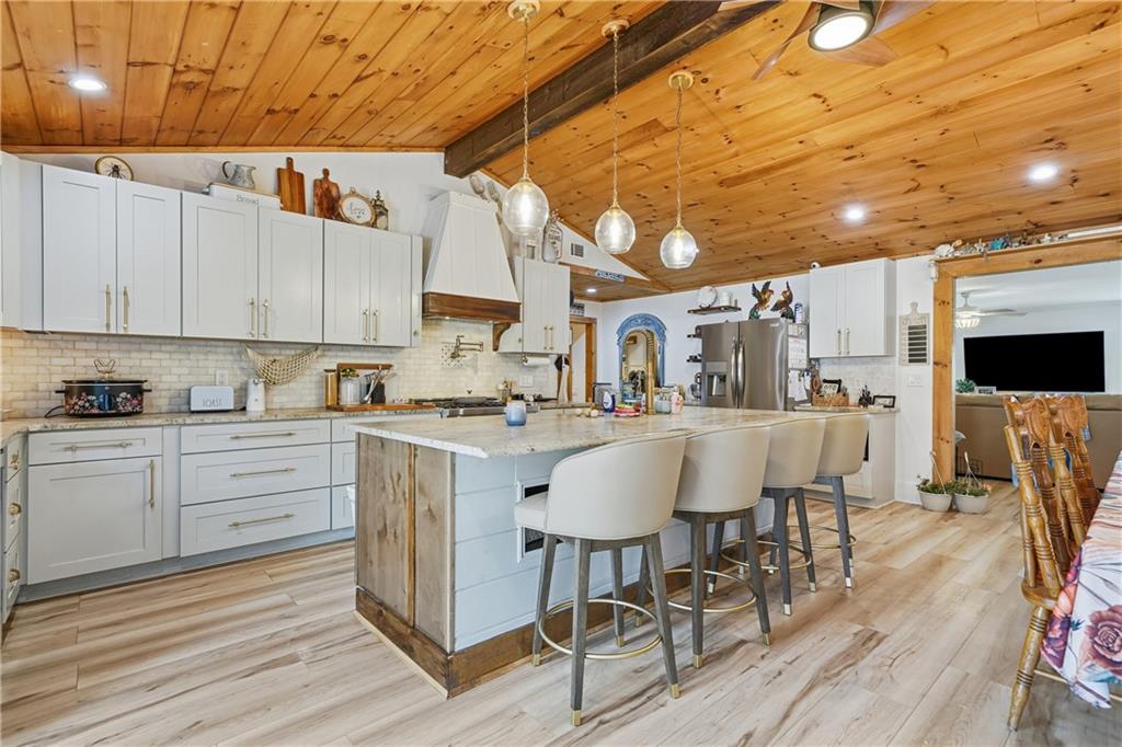 34 Bodie Road Talking Rock, GA 30175 - Photo 12 of 49 a kitchen with a sink cabinets and wooden floor