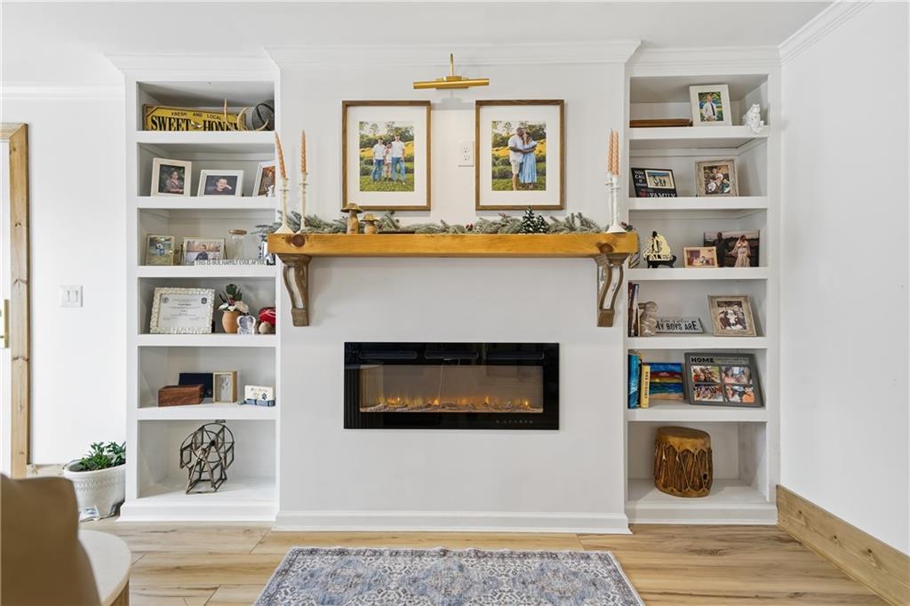 34 Bodie Road Talking Rock, GA 30175 - Photo 14 of 49 a living room with white cabinets and a fireplace