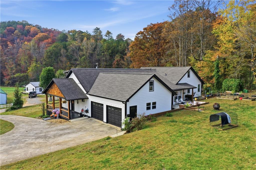 34 Bodie Road Talking Rock, GA 30175 - Photo 2 of 49 a aerial view of a house with swimming pool and sitting area