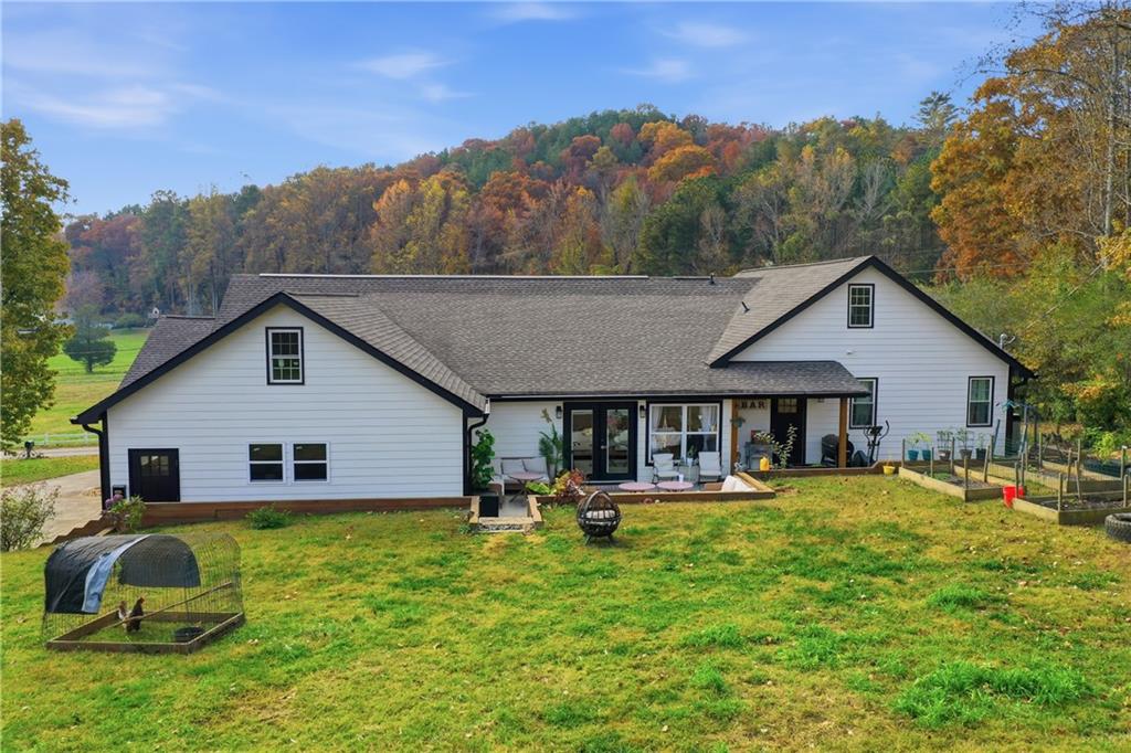 34 Bodie Road Talking Rock, GA 30175 - Photo 21 of 49 a view of a house with pool and chairs