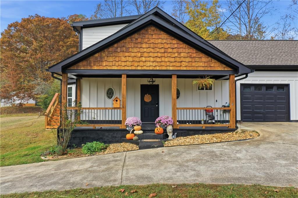 34 Bodie Road Talking Rock, GA 30175 - Photo 22 of 49 a front view of a house with garden