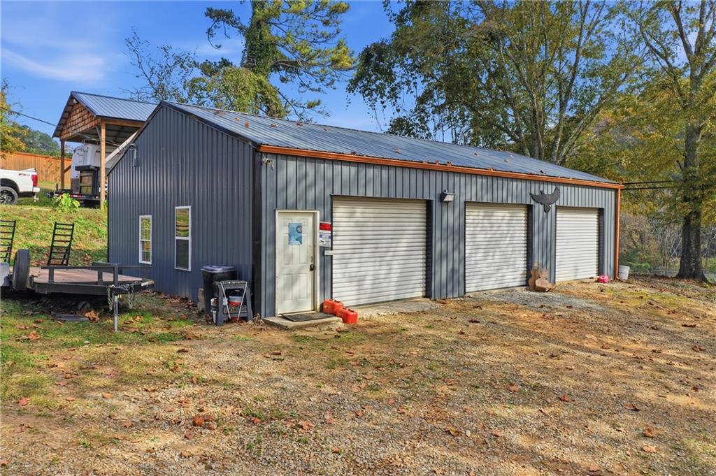 34 Bodie Road Talking Rock, GA 30175 - Photo 23 of 49 a view of a house with backyard porch and sitting area