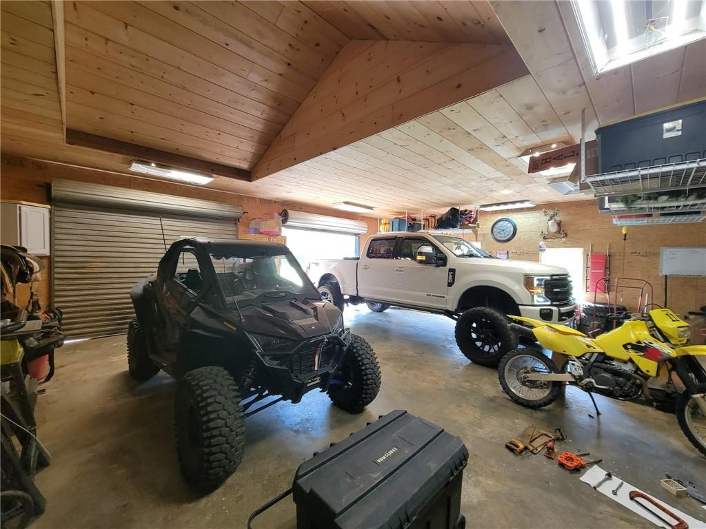 34 Bodie Road Talking Rock, GA 30175 - Photo 24 of 49 a view of a garage with parked cars