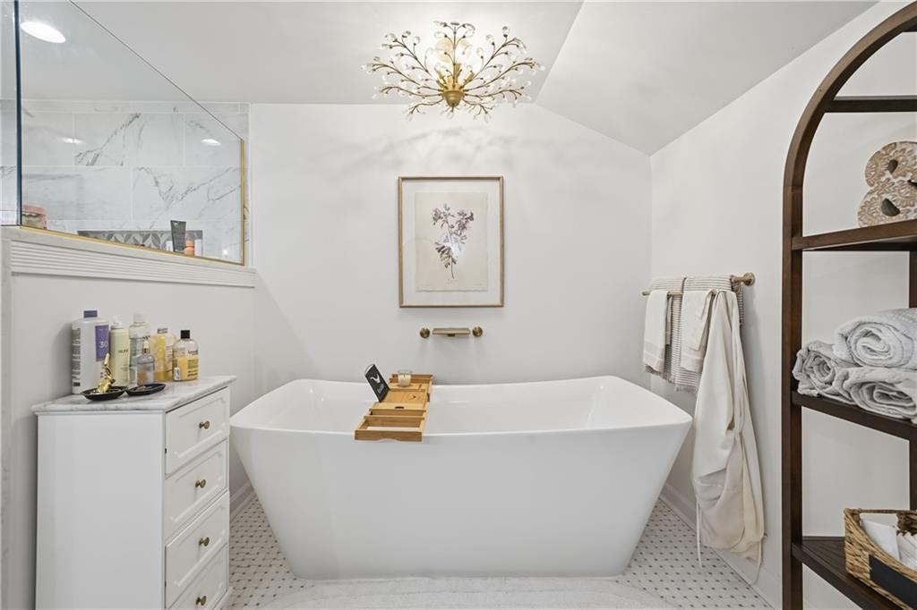 34 Bodie Road Talking Rock, GA 30175 - Photo 27 of 49 a white bath tub sitting next to a bathroom