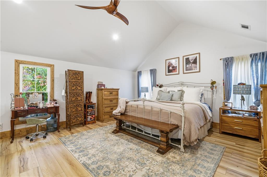 34 Bodie Road Talking Rock, GA 30175 - Photo 31 of 49 a bedroom with a bed and wooden floor