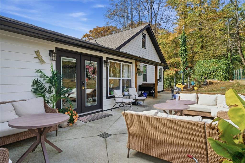 34 Bodie Road Talking Rock, GA 30175 - Photo 32 of 49 a view of a house with a patio and a yard