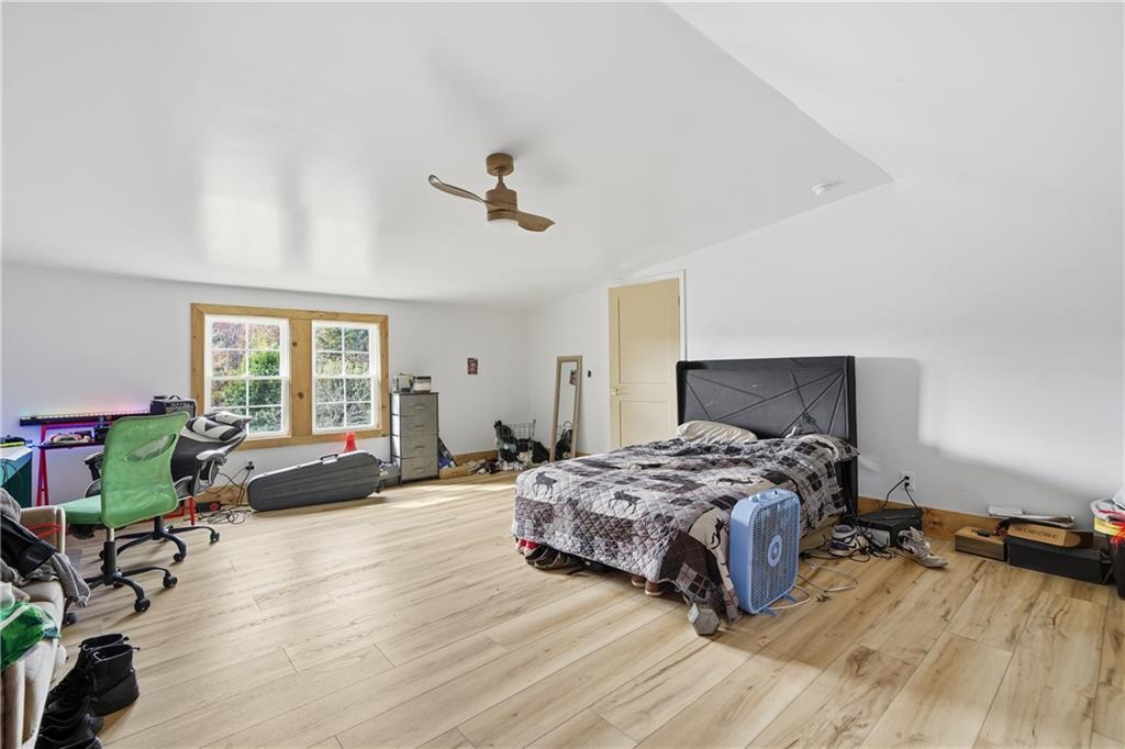 34 Bodie Road Talking Rock, GA 30175 - Photo 38 of 49 a bedroom with a bed couch and a window