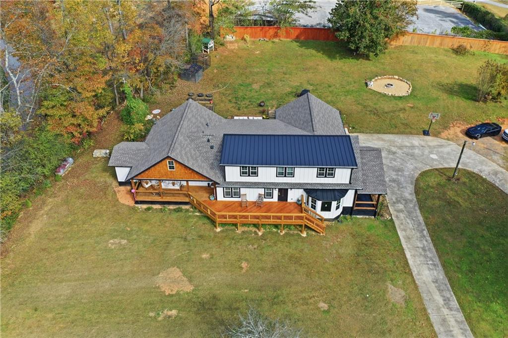 34 Bodie Road Talking Rock, GA 30175 - Photo 5 of 49 an aerial view of a house with swimming pool and patio
