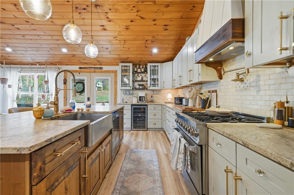 34 Bodie Road Talking Rock, GA 30175 - Photo 8 of 49 a kitchen with stainless steel appliances granite countertop a sink a stove and cabinets