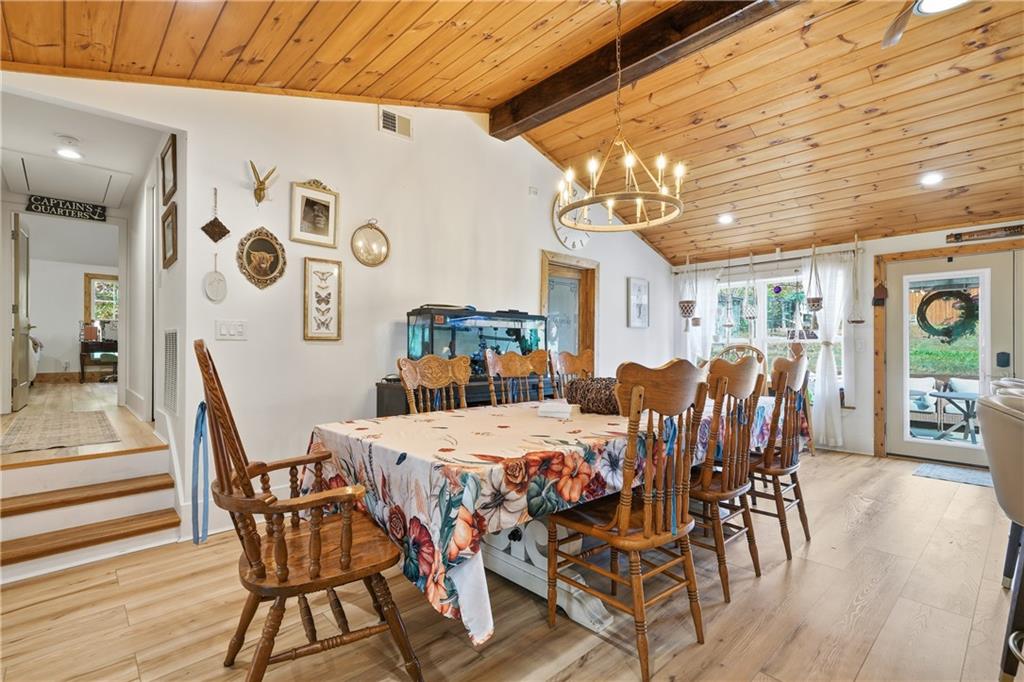 34 Bodie Road Talking Rock, GA 30175 - Photo 10 of 49 a view of a dining room with furniture and wooden floor