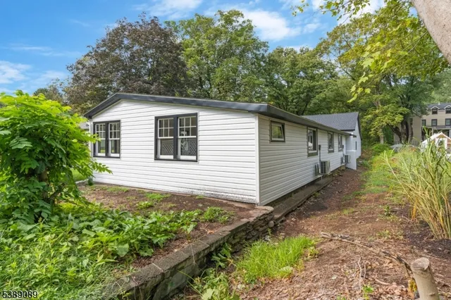 a house view with a backyard space