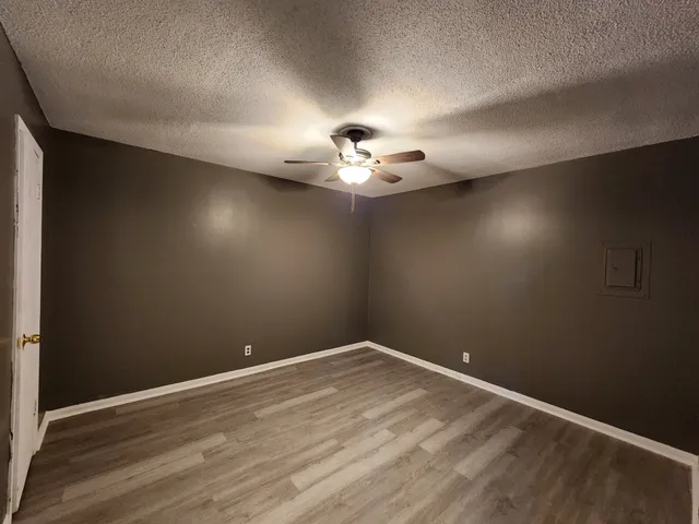 a view of a room with a hanging light