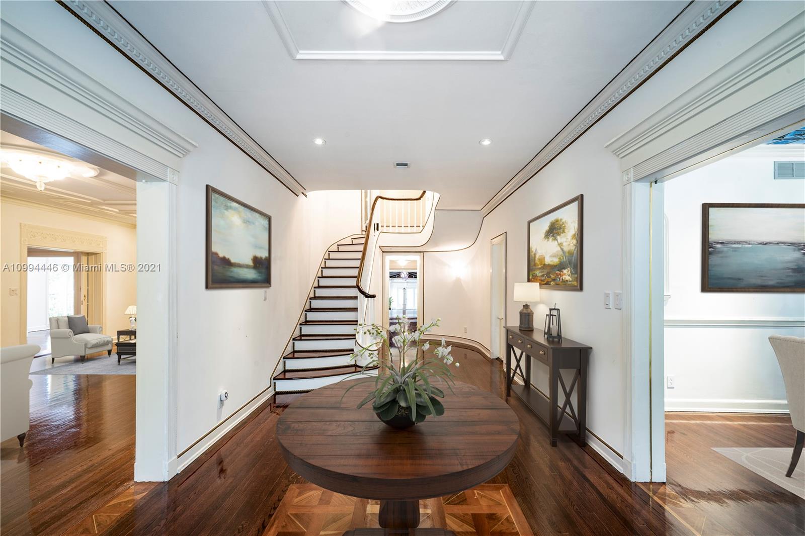 3916 Granada Boulevard Coral Gables, FL 33134 - Photo 15 of 75 a living room with furniture and a wooden floor