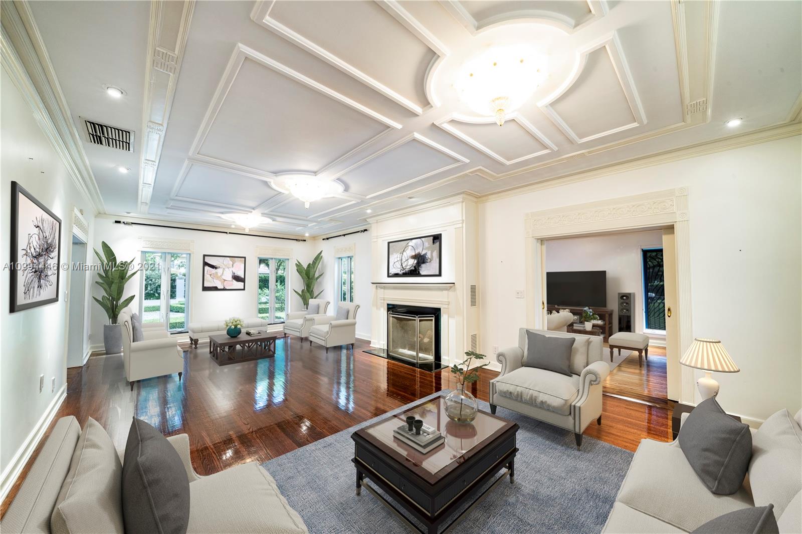 3916 Granada Boulevard Coral Gables, FL 33134 - Photo 16 of 75 a living room with fireplace furniture and a large window
