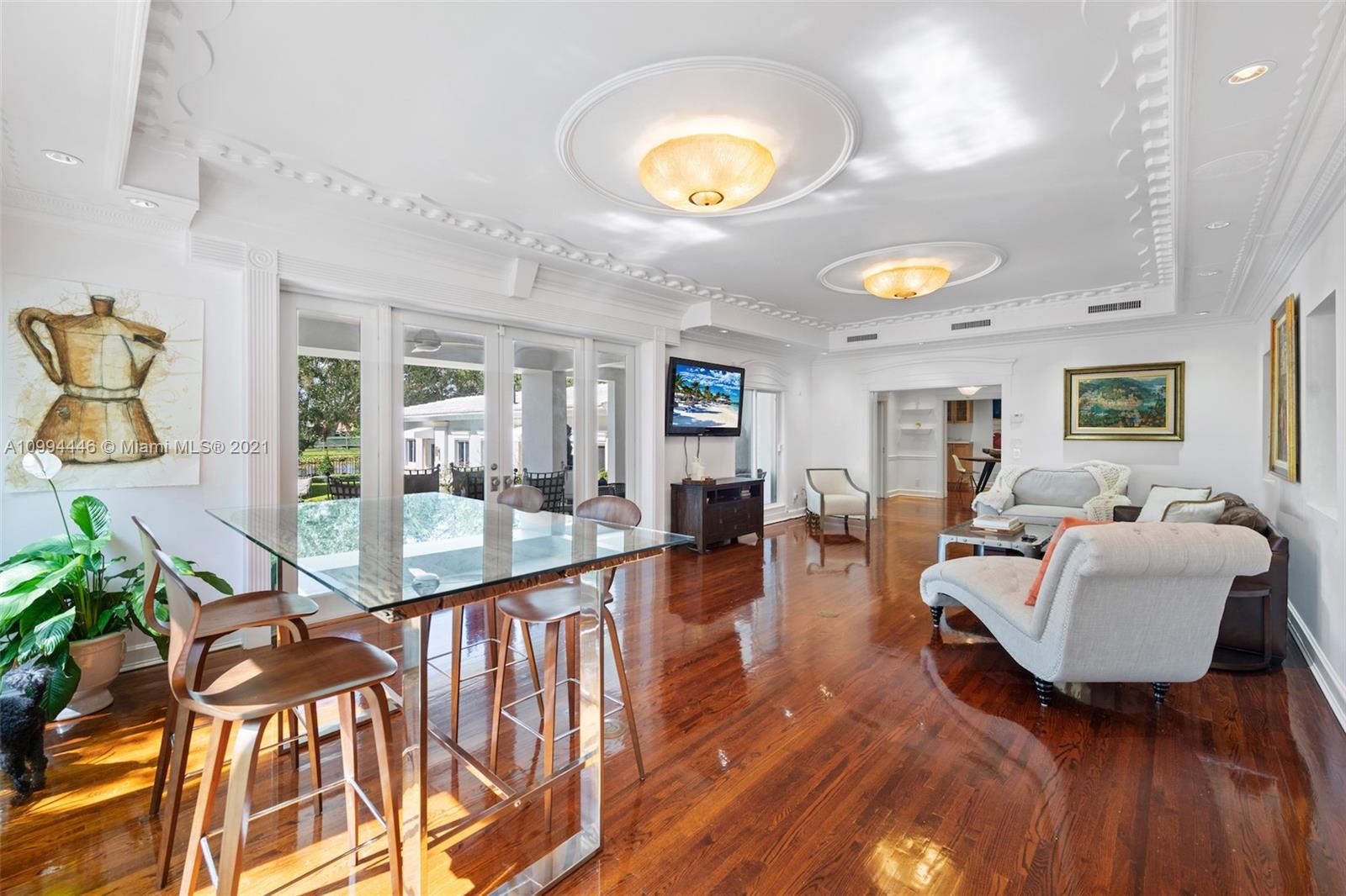 3916 Granada Boulevard Coral Gables, FL 33134 - Photo 17 of 75 a living room with fireplace furniture and a large window