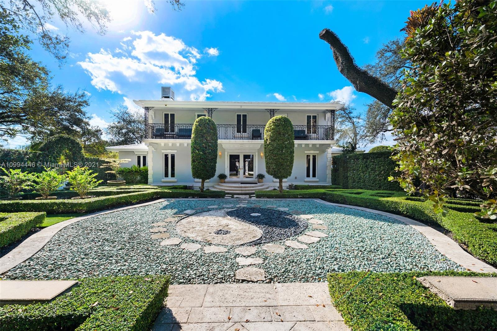 3916 Granada Boulevard Coral Gables, FL 33134 - Photo 2 of 75 a front view of a house with garden
