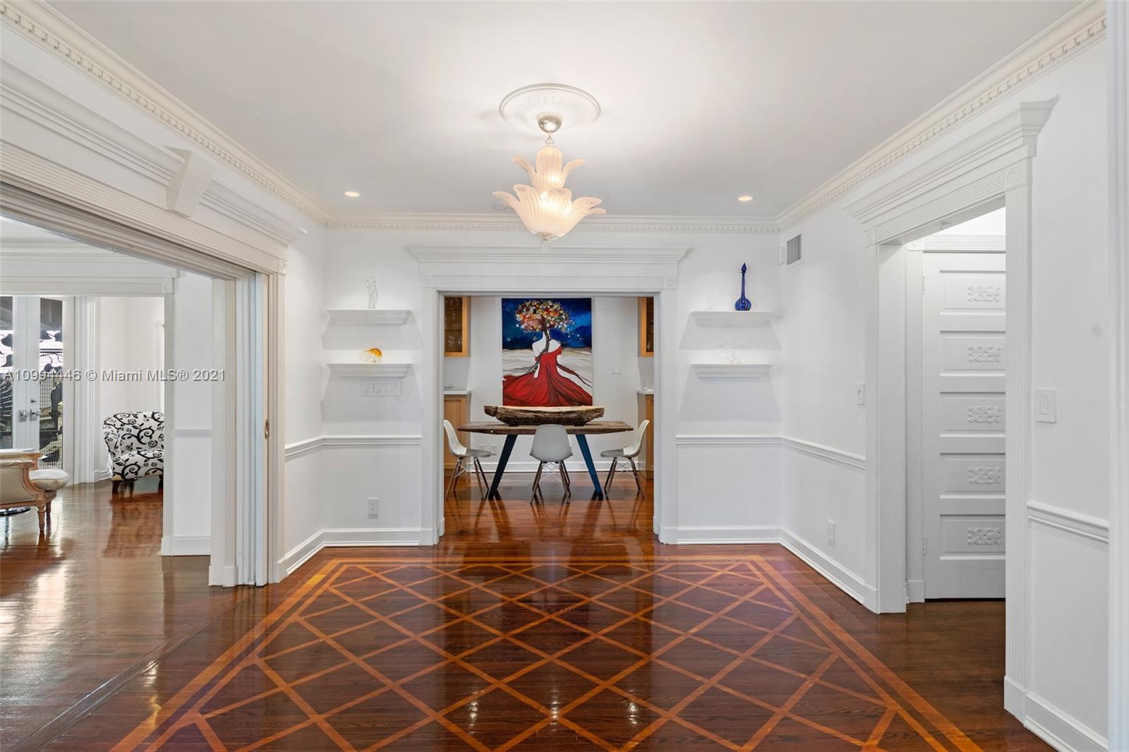 3916 Granada Boulevard Coral Gables, FL 33134 - Photo 29 of 75 wooden floor in an empty room with a window