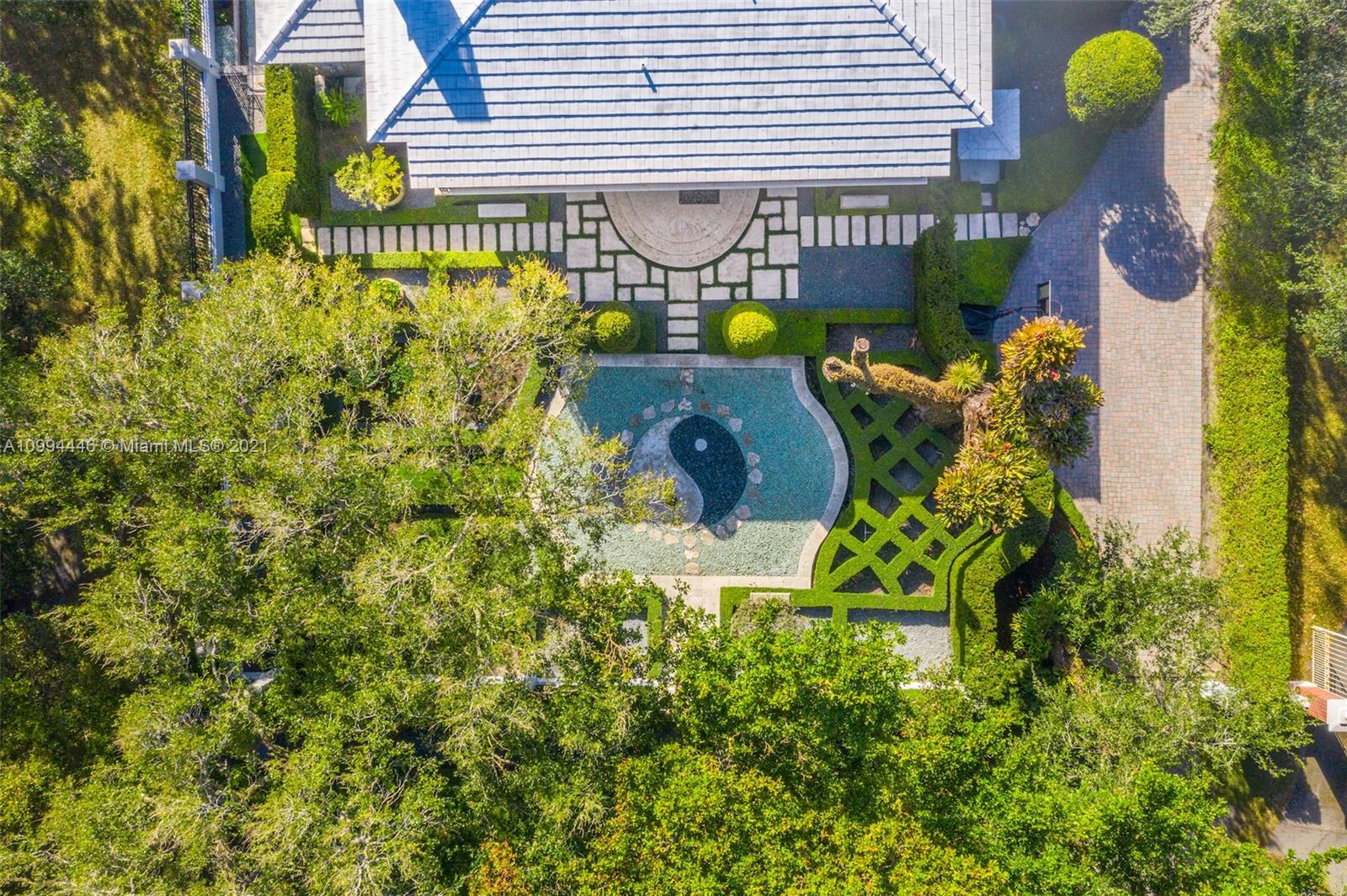 3916 Granada Boulevard Coral Gables, FL 33134 - Photo 66 of 75 a front view of a house with garden