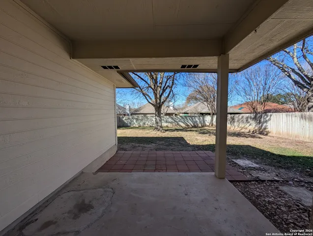 a view of a back yard from a room