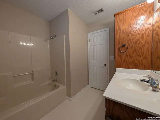 a bathroom with a sink and a tub