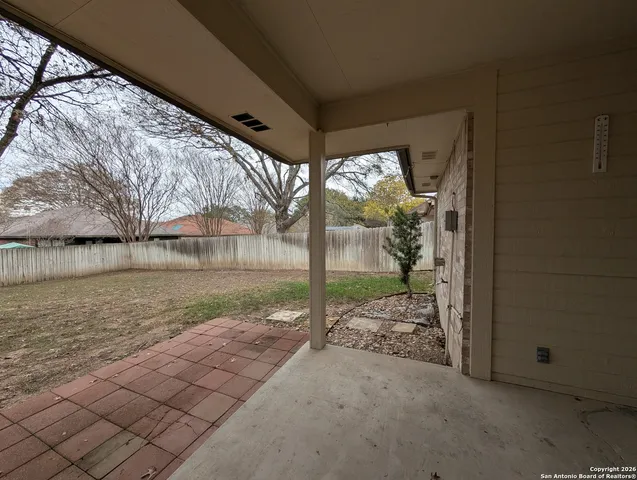a view of a house with backyard from a porch