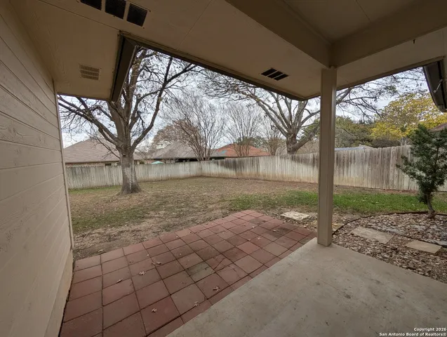 a view of backyard with green space