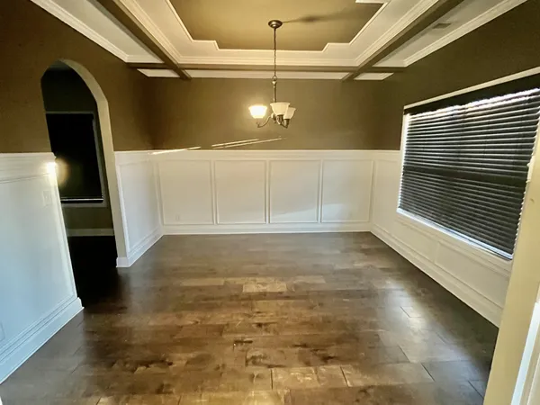 a view of a hallway view with wooden floor and staircase