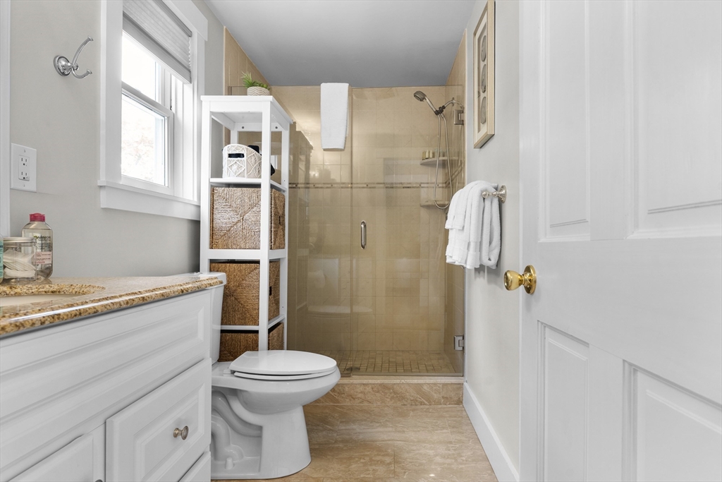 4 Hye Lane Edgartown, MA 02539 - Photo 14 of 41 a bathroom with a granite countertop sink toilet and shower