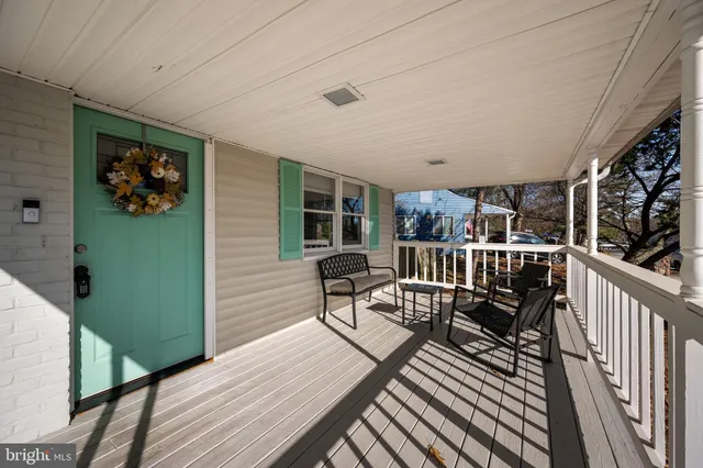 a view of a balcony with chairs