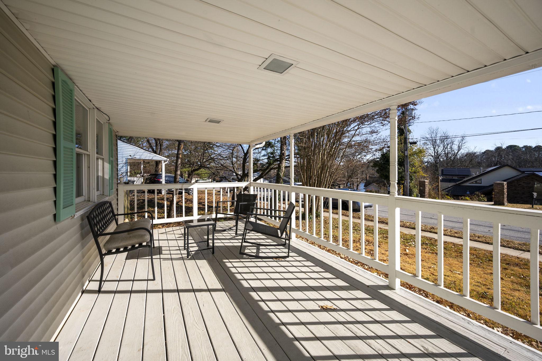 3 Leymar Road Glen Burnie, MD 21060 - Photo 12 of 60 a view of a balcony with chairs wooden floor and fence