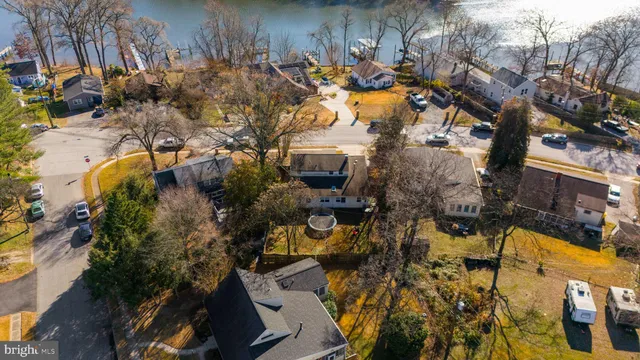 an aerial view of a house with a lake view