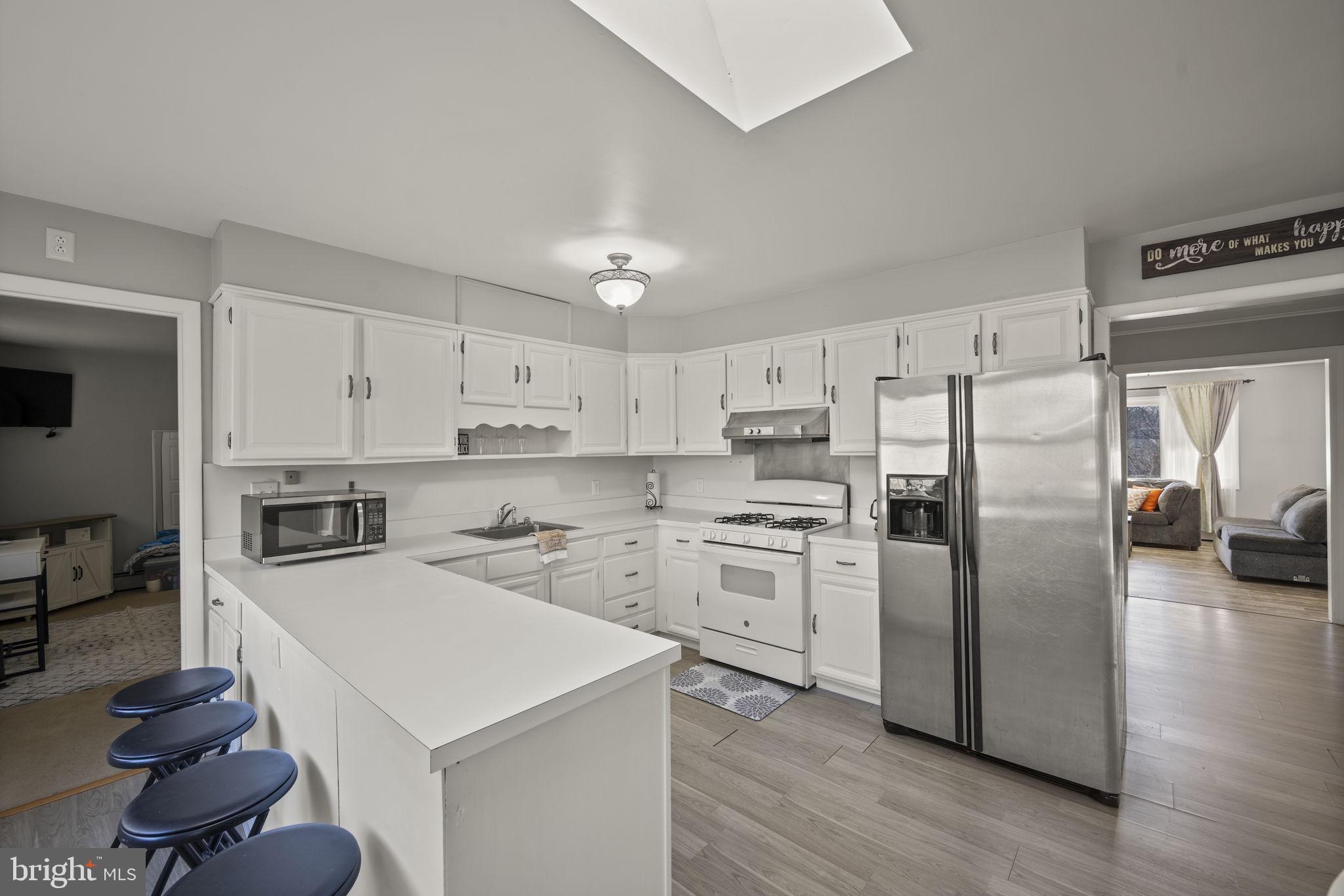 3 Leymar Road Glen Burnie, MD 21060 - Photo 18 of 60 a kitchen with stainless steel appliances a refrigerator sink and stove