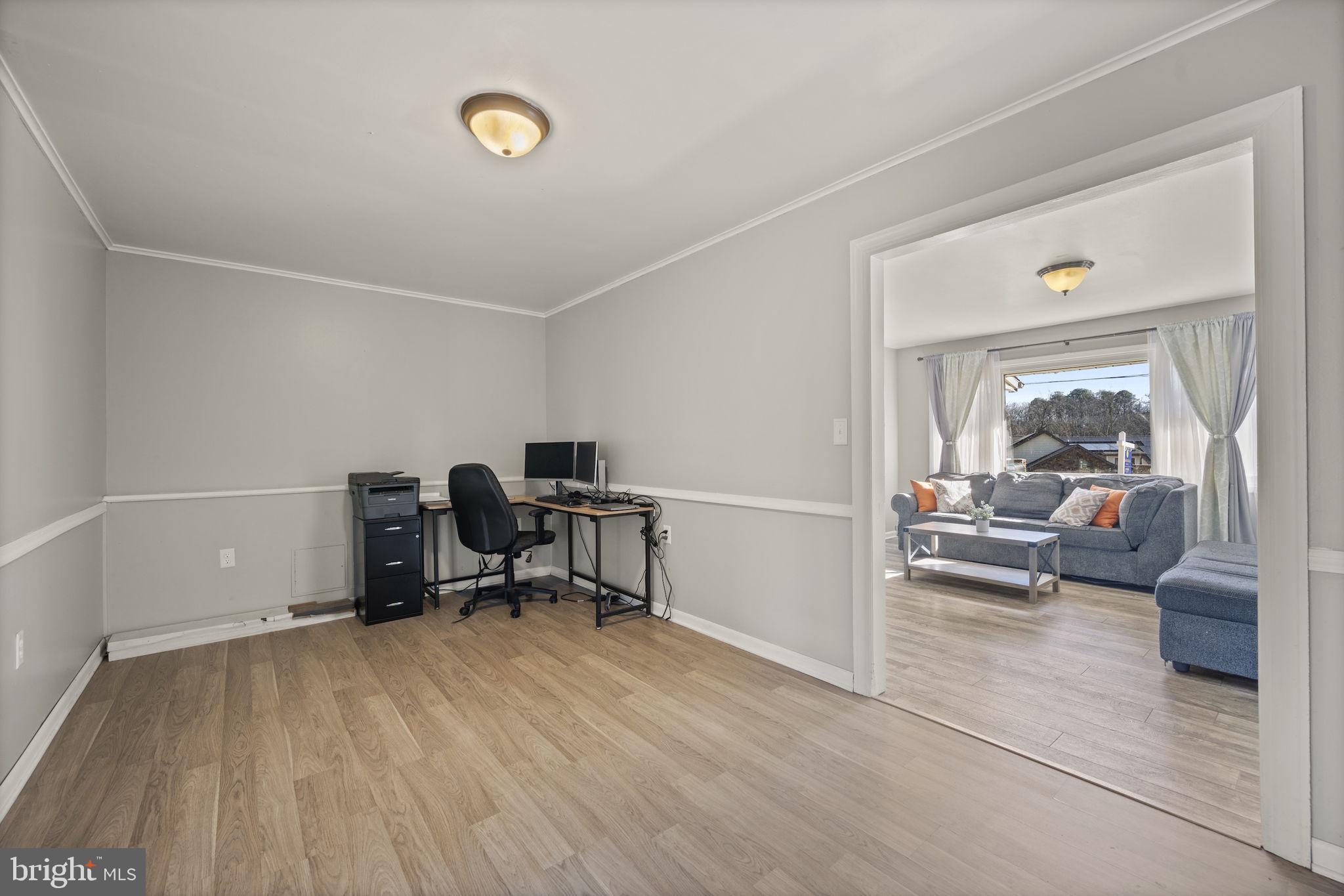 3 Leymar Road Glen Burnie, MD 21060 - Photo 27 of 60 a view of a workspace with furniture and a window