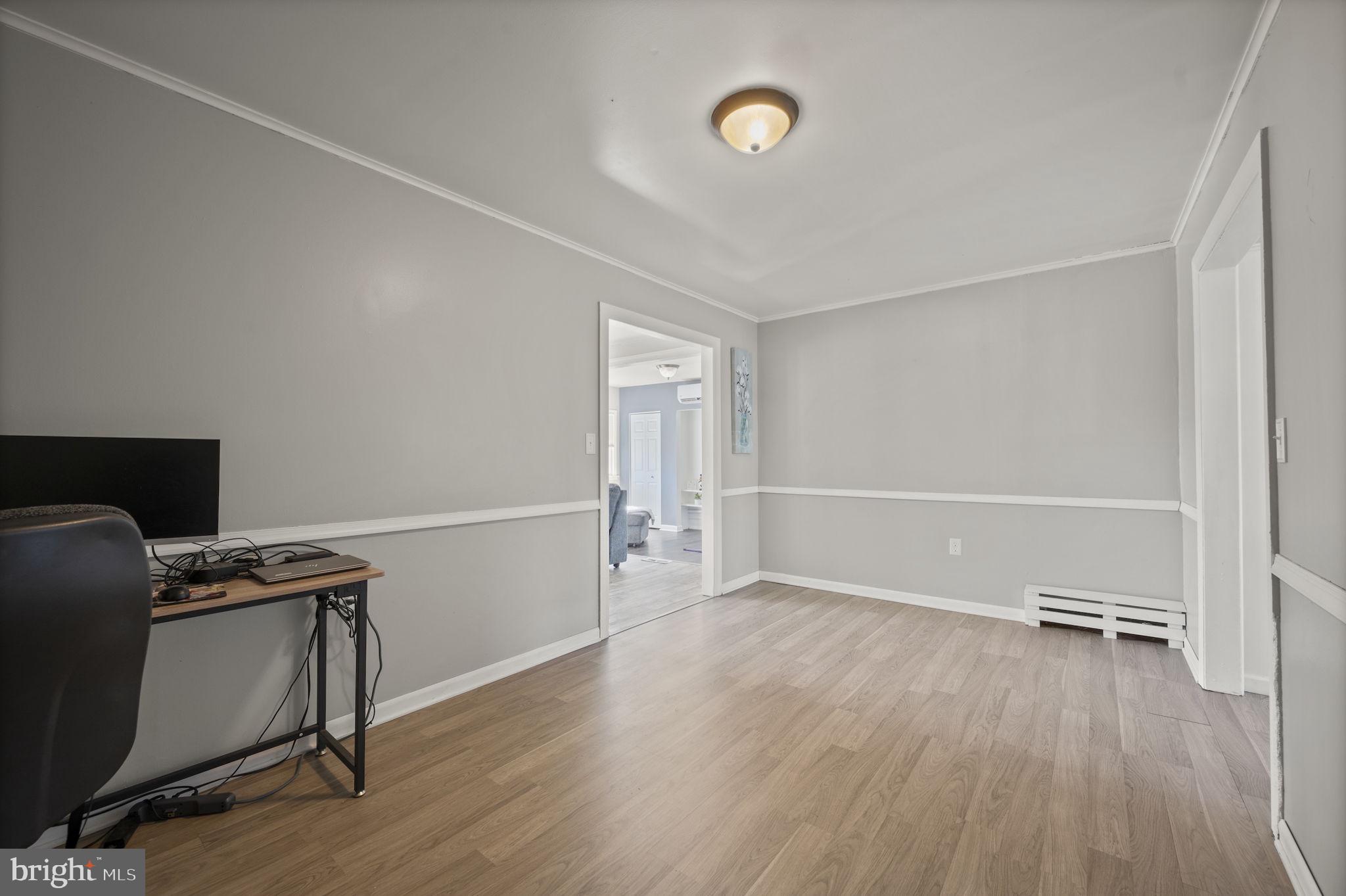 3 Leymar Road Glen Burnie, MD 21060 - Photo 28 of 60 a view of a workspace with furniture and wooden floor