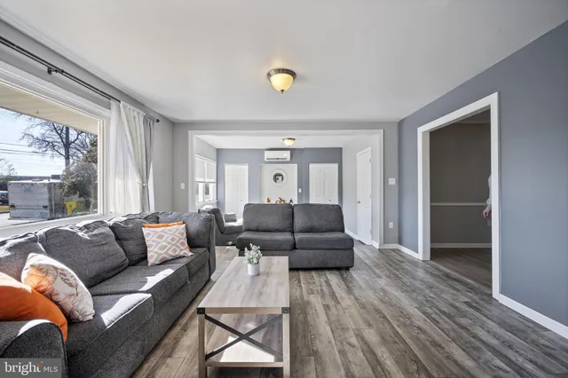a living room with furniture and window