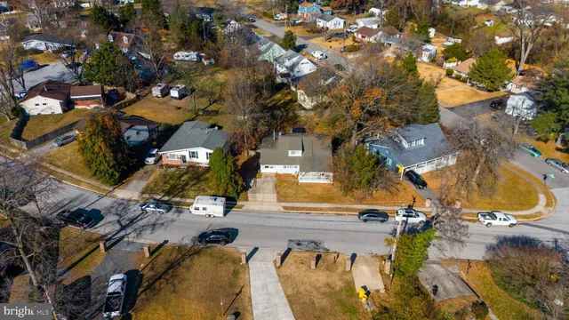 an aerial view of a house with a swimming pool