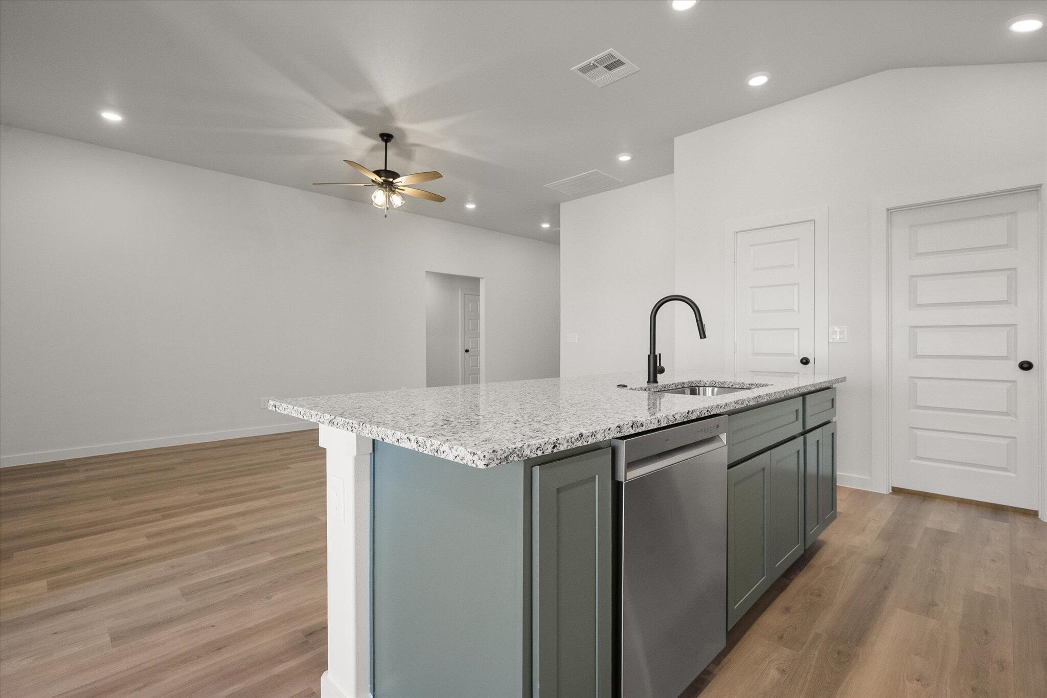 2422 Aberdeen Avenue Wolfforth, TX 79382 - Photo 11 of 23 a kitchen with granite countertop a sink and dishwasher