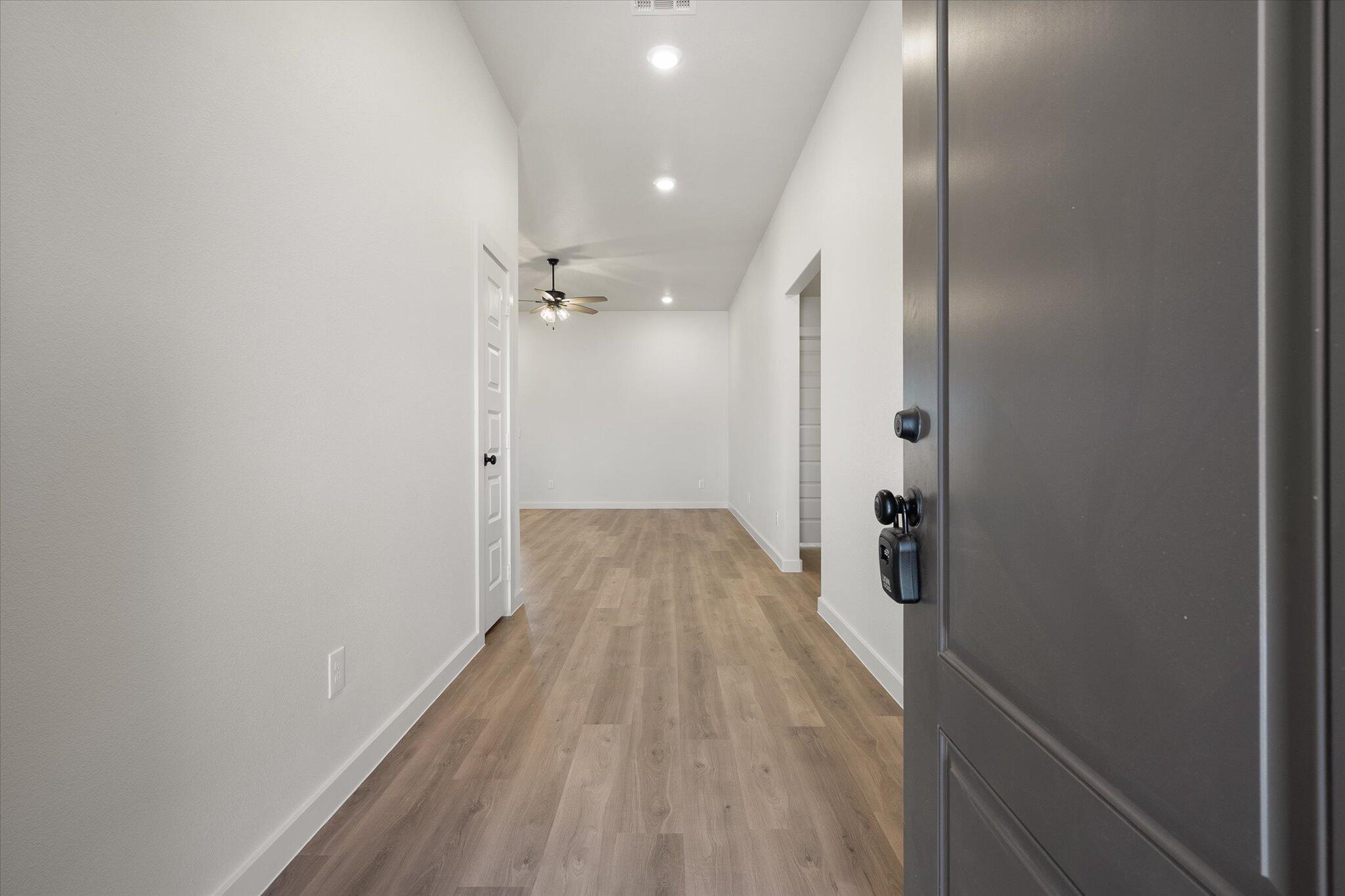 2422 Aberdeen Avenue Wolfforth, TX 79382 - Photo 2 of 23 a view of a room with wooden floor