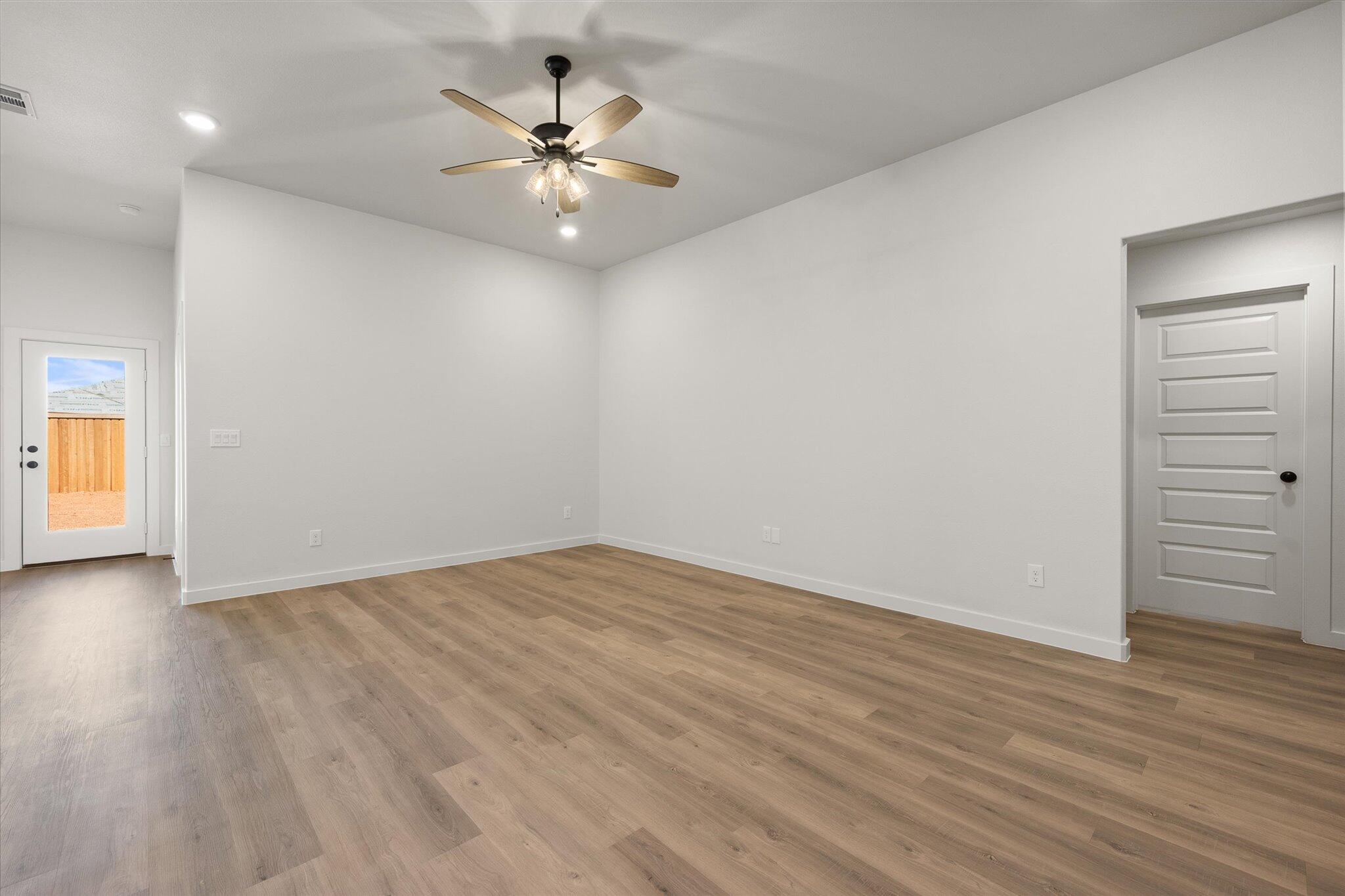 2422 Aberdeen Avenue Wolfforth, TX 79382 - Photo 4 of 23 a view of an empty room with wooden floor