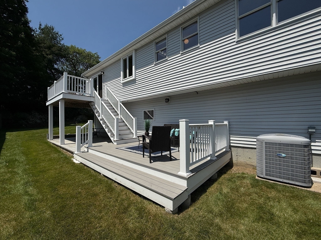 45 Susan Drive Saugus, MA 01906 - Photo 27 of 30 a view of a house with a yard and deck