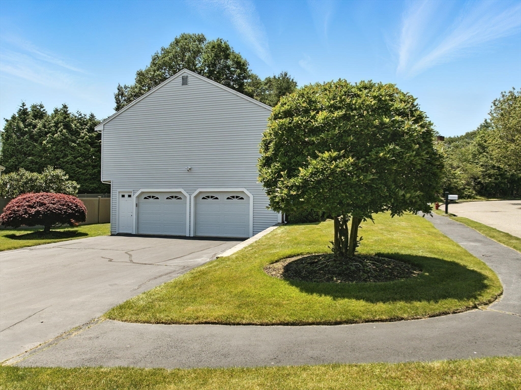 45 Susan Drive Saugus, MA 01906 - Photo 28 of 30 a view of a wooden house with a yard and large tree
