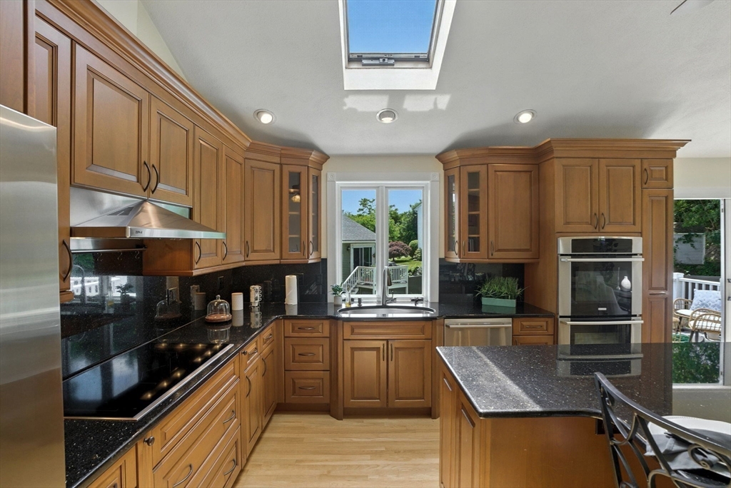 45 Susan Drive Saugus, MA 01906 - Photo 3 of 30 a kitchen with stainless steel appliances granite countertop counter space a sink and cabinets
