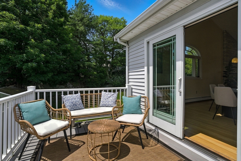 45 Susan Drive Saugus, MA 01906 - Photo 8 of 30 a view of a chair and table in the balcony