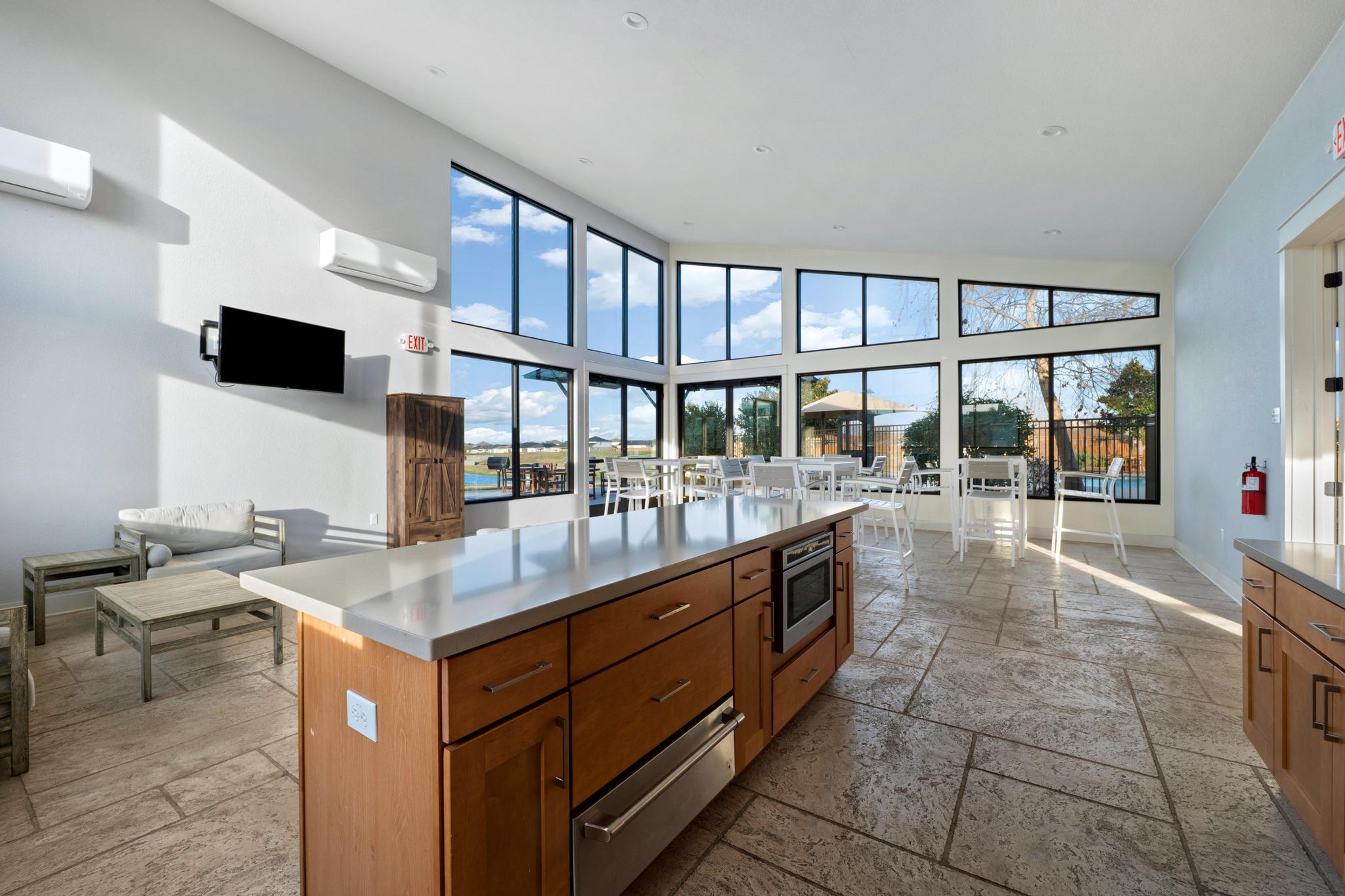 133 Konik Road Georgetown, TX 78626 - Photo 24 of 29 a dining hall with stainless steel appliances granite countertop a large stove a sink and a refrigerator