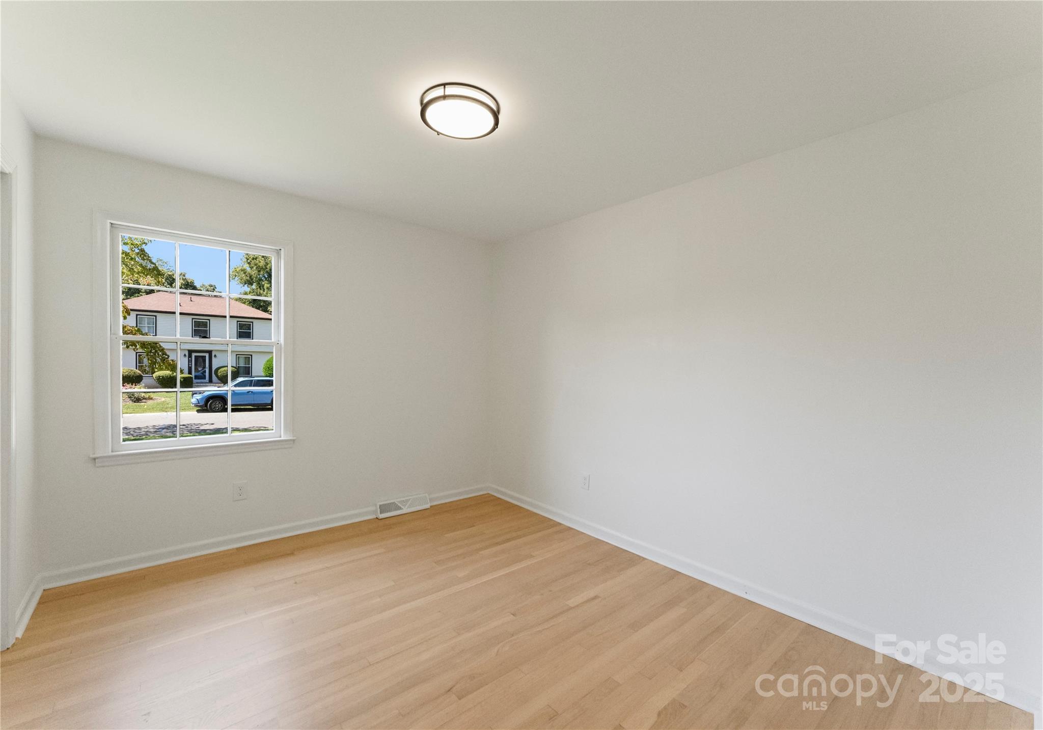 6101 Powder Horn Road Charlotte, NC 28212 - Photo 11 of 27 an empty room with a window