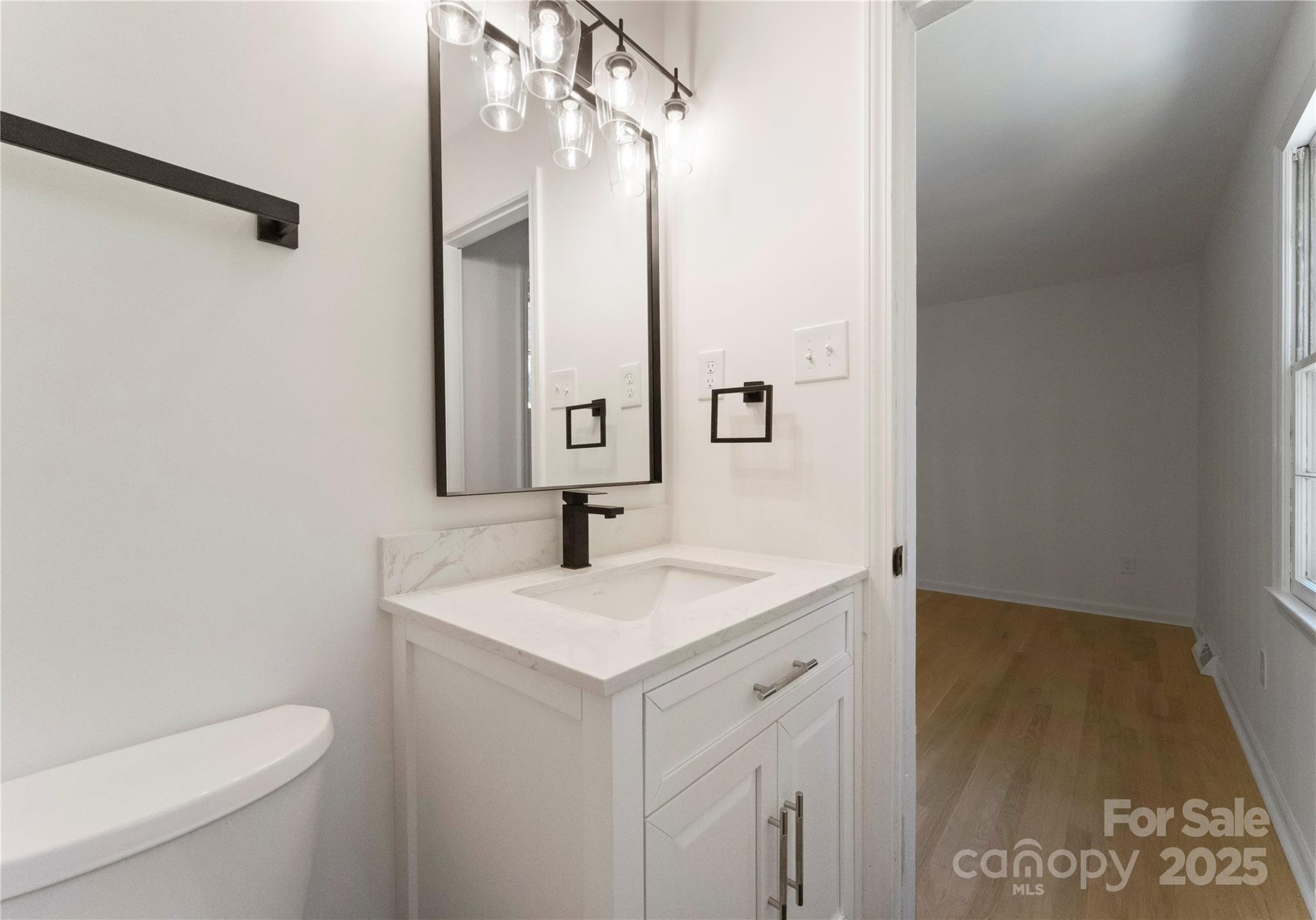 6101 Powder Horn Road Charlotte, NC 28212 - Photo 15 of 27 a bathroom with a sink and a mirror