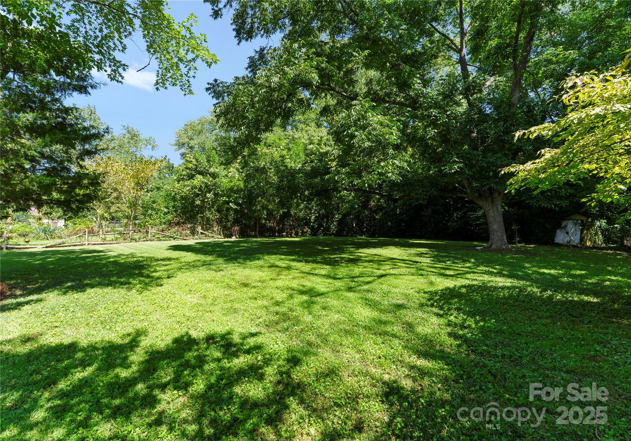 6101 Powder Horn Road Charlotte, NC 28212 - Photo 17 of 27 a view of outdoor space with deck and yard