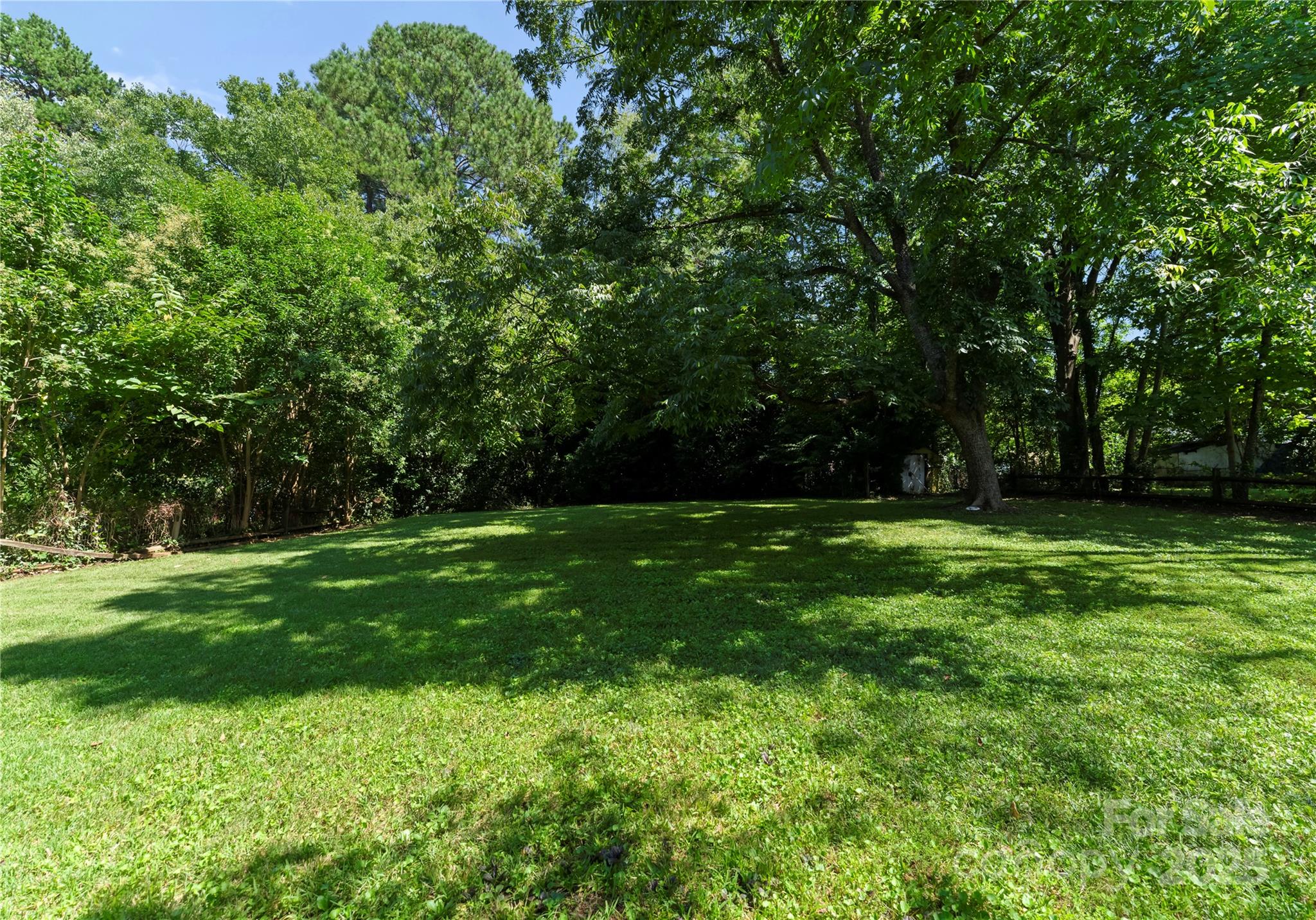 6101 Powder Horn Road Charlotte, NC 28212 - Photo 18 of 27 a view of outdoor space with deck and yard